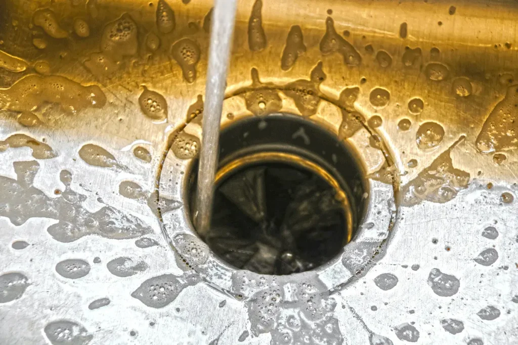 Water running down a garbage disposal